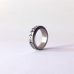 Spinner anxiety ring with engraved spinner. engraves include half moon, stars and small planets.