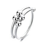 Double coiled silver wire ring with fidget rings moving on it